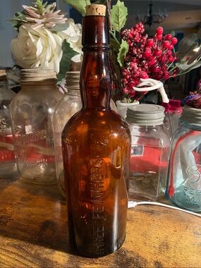 Three Feathers Amber Glass Bottle Vase with Cork Stopper